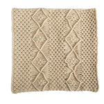 Beige knitted blanket with a diamond pattern on a white background