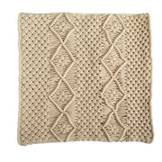 Beige knitted blanket with a diamond pattern on a white background