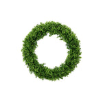 A circular artificial green foliage wreath made of dense faux boxwood or similar small leafy branches, centered on a plain white background.