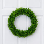 Green wreath on a white door