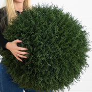 Round artificial cedar topiary ball with dense evergreen foliage