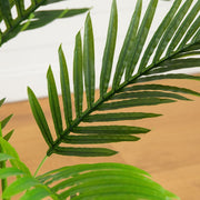 Green faux areca palm with full feathery fronds for indoor décor