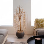 Decorative plant with lights in a living room setting