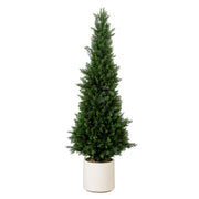 Tall green artificial Christmas tree in a white pot on a white background