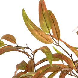 Artificial leaves with green and brown hues on a white background
