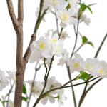 White artificial flowering branches with green leaves and yellow centers, shown against a plain white background.