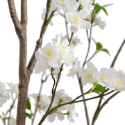 White artificial flowering branches with green leaves and yellow centers, shown against a plain white background.
