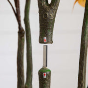 Green pruning tool with a metallic blade on a white background