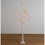 Artificial Valentine's Day twig tree with red berry clusters and LED lights.