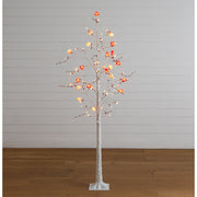 Artificial Valentine's Day twig tree with red berry clusters and LED lights.