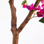 Close-up of a faux bougainvillea branch with a realistic brown bark texture and bright pink flowers on a white background.