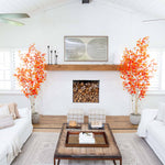 Modern living room with white walls, wooden coffee table, and decorative elements.