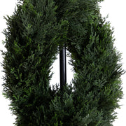 Green artificial wreath on a white background