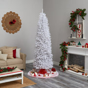 Decorated living room with a white Christmas tree, fireplace, and festive decorations.