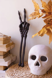 Cast iron skeleton arm peace sign Halloween decor