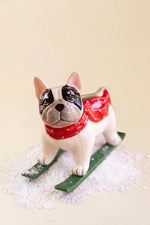 Glazed ceramic skiing dog sculpture for mantels, shelves and holiday displays