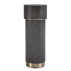 Cylindrical decorative object with textured surface and gold accents on a white background