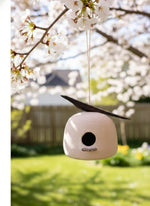 Clay and wood birdhouse