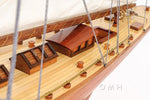 Close-up of a wooden model ship with detailed craftsmanship