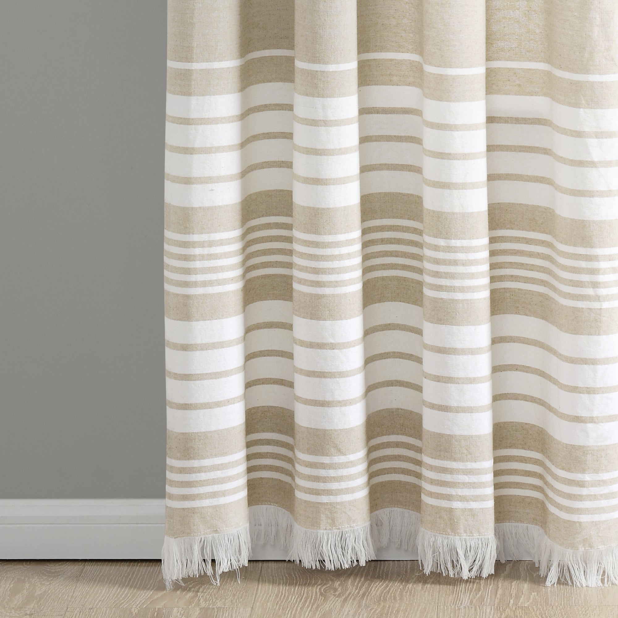 https://uberbazaar.com/cdn/shop/products/16T004549-NANTUCKET-YARN-DYED-COTTON-TASSEL-FRINGE-TAUPE-WINDOW-PANEL-40X84-PAIR-848742088395-ALT-2.jpg?v=1602242152