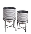 Benzara BM217050 Round Cylindrical Metal Planter with Tubular Legs, Set of 2,White and Black