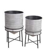 Benzara BM217050 Round Cylindrical Metal Planter with Tubular Legs, Set of 2,White and Black