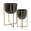 Benzara Round Metal Planter with X Shape Tubular Stand, Set of 2, Black and Brass