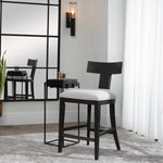 Contemporary wooden counter stool with cushioned black seat by Uttermost